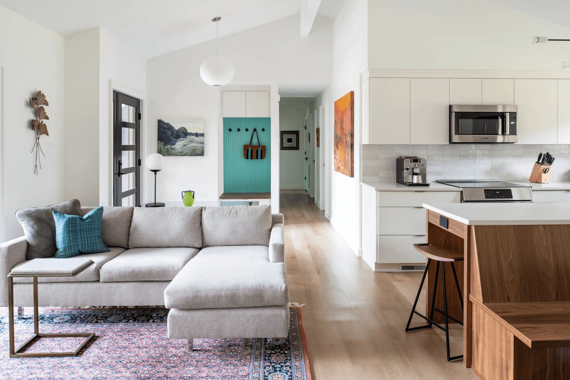 a large kitchen with a center island and lots of chairs