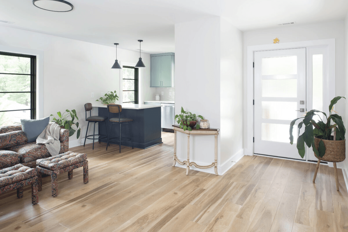 a living room filled with furniture and a wooden floor