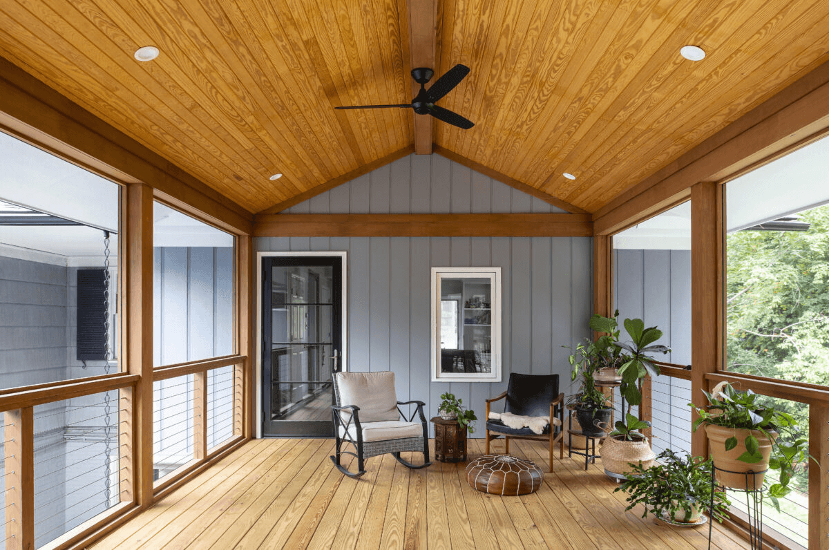 a room with wooden floors and a ceiling fan